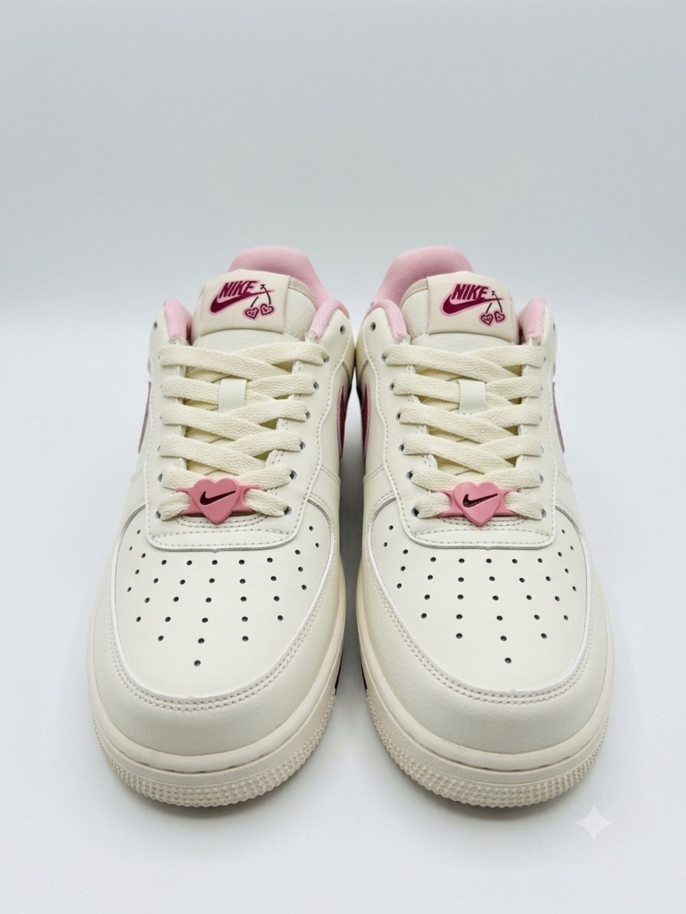Nike Women's Low-Top Sneakers in Cream and Pink